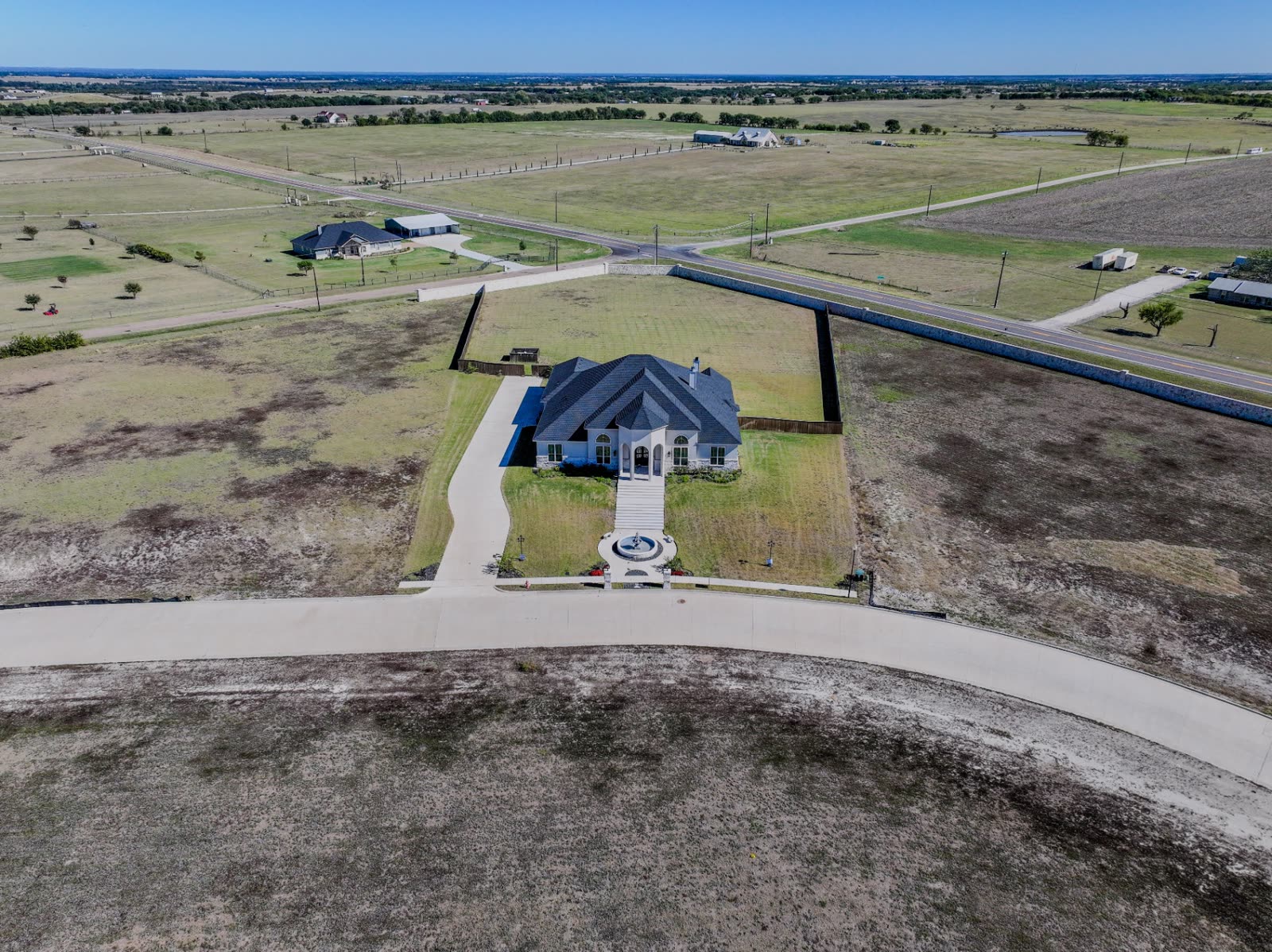 Aerial photo of luxury Texas home with manicured grounds
