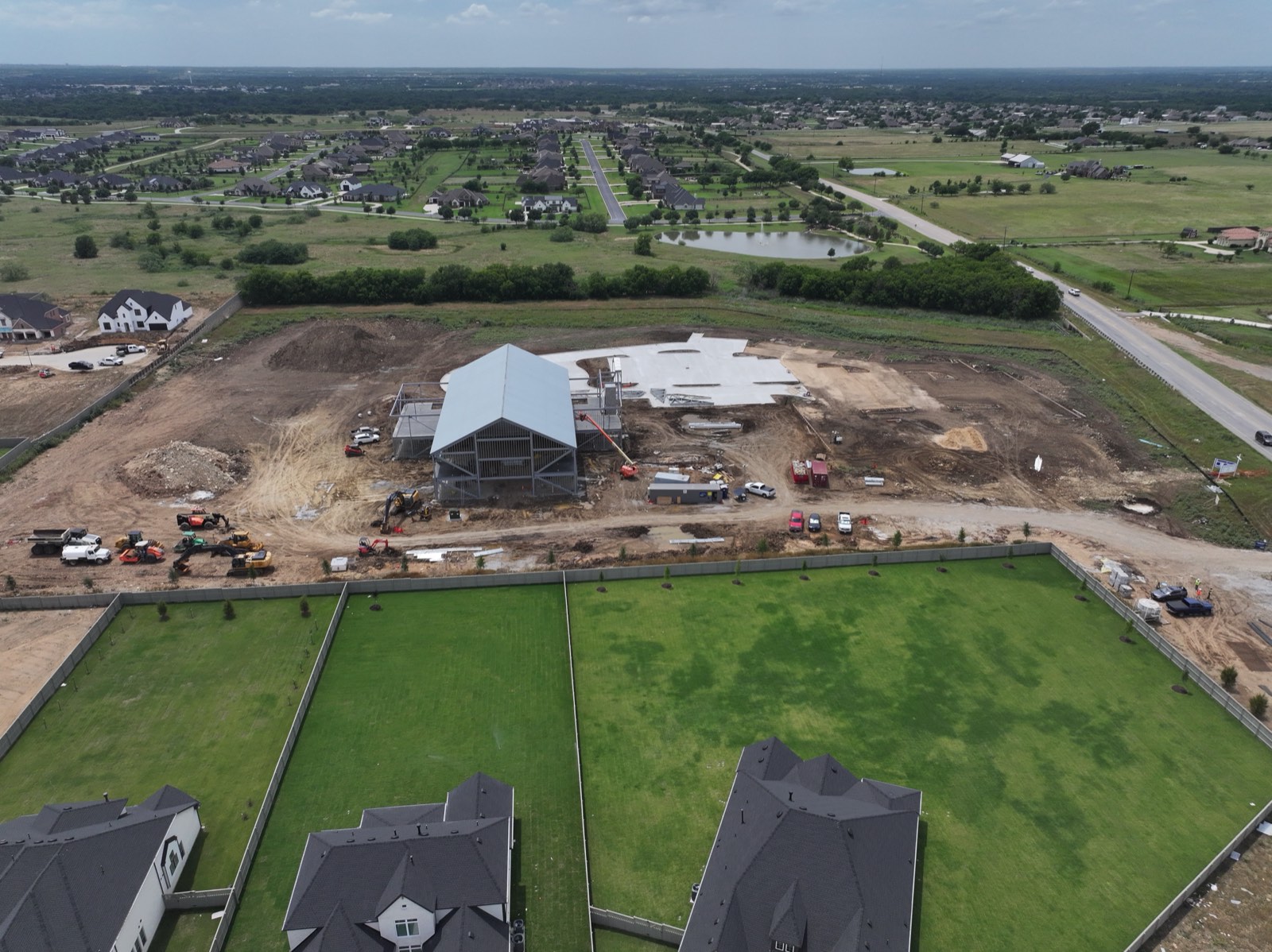 Aerial view of large-scale commercial build during steel structure phase, Northlake TX